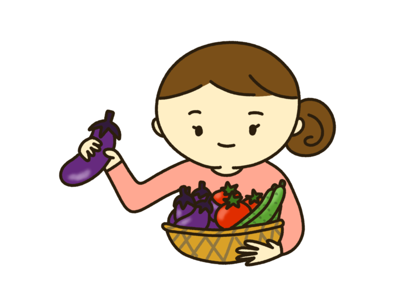 夏野菜を持つ主婦